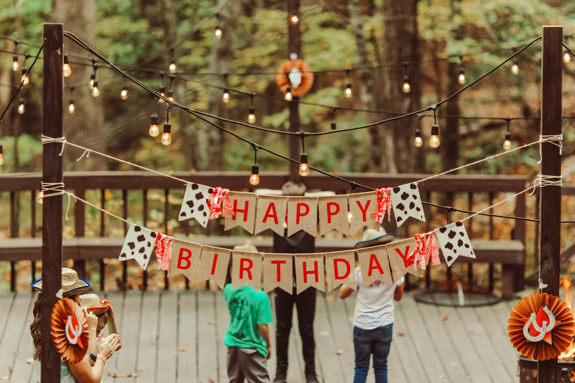 Friends celebrating at an evening birthday party